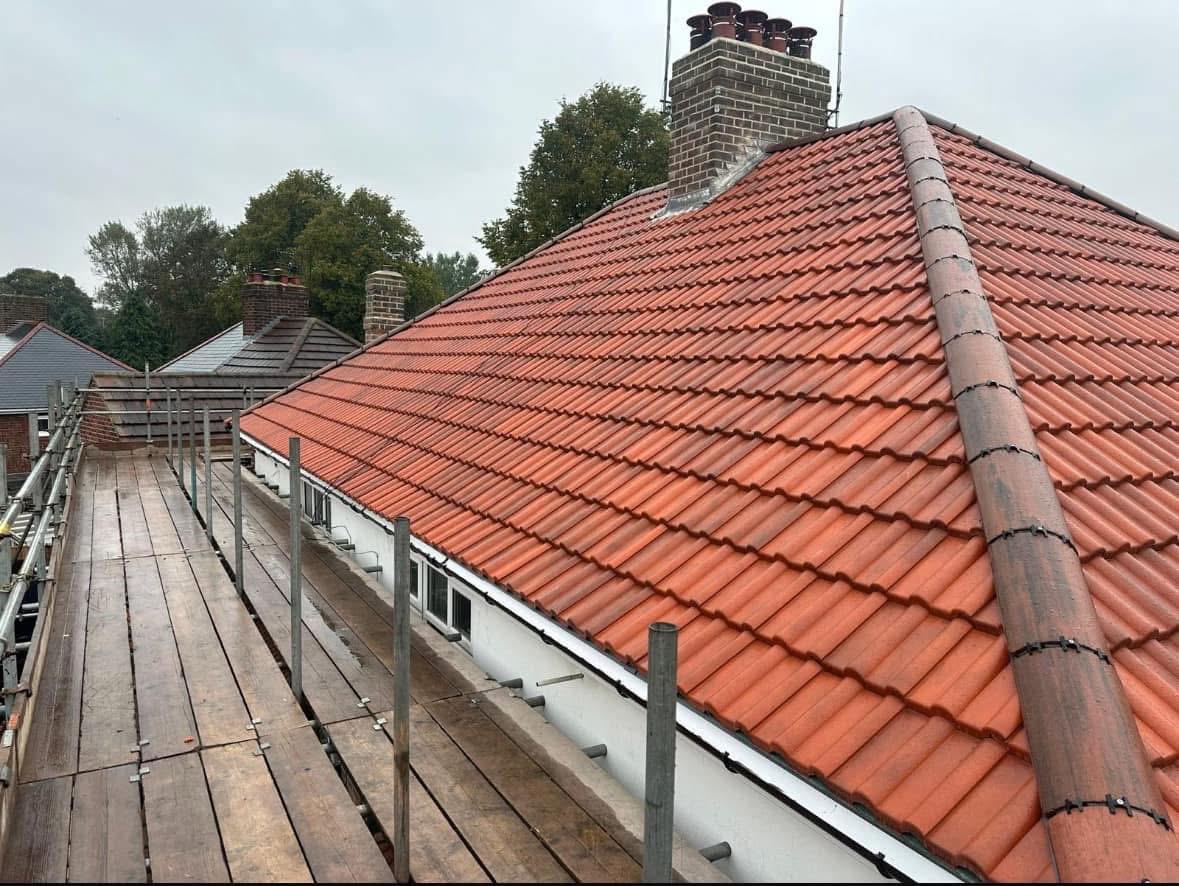 Tiled roof with re-bedded ridge and sound pointing